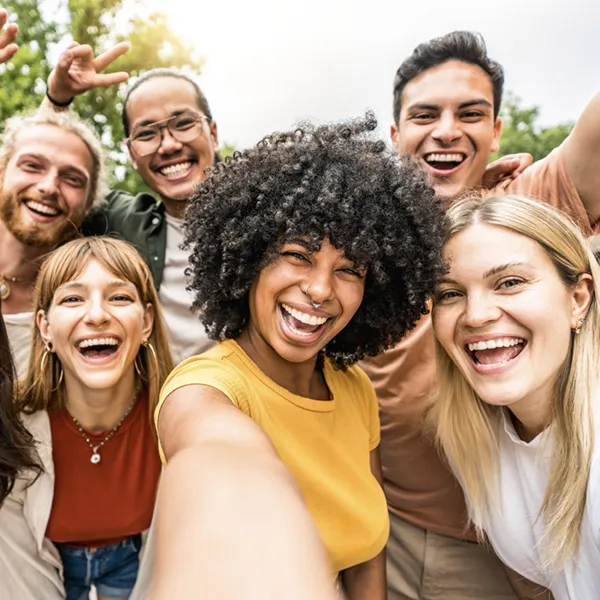 group of adult friends smiling and laughing
