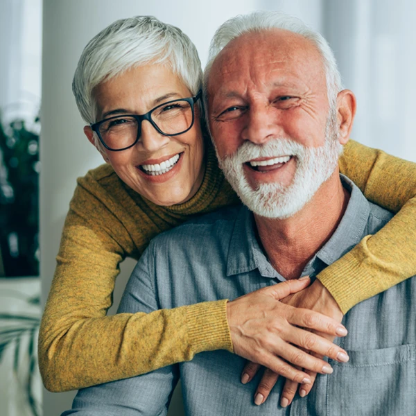 mature couple embracing and smiling
